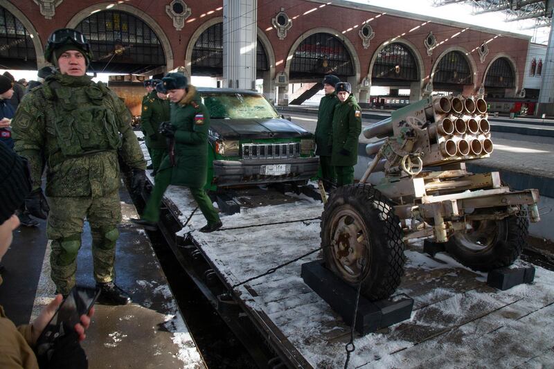 Russian soldiers stand next to a homemade mortar. AP Photo