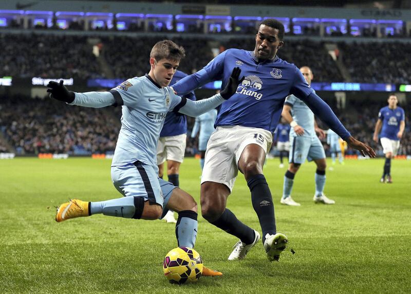 Jose Pozo of Manchester City and Sylvain Distin of Everton (Photo by AMA/Corbis via Getty Images)