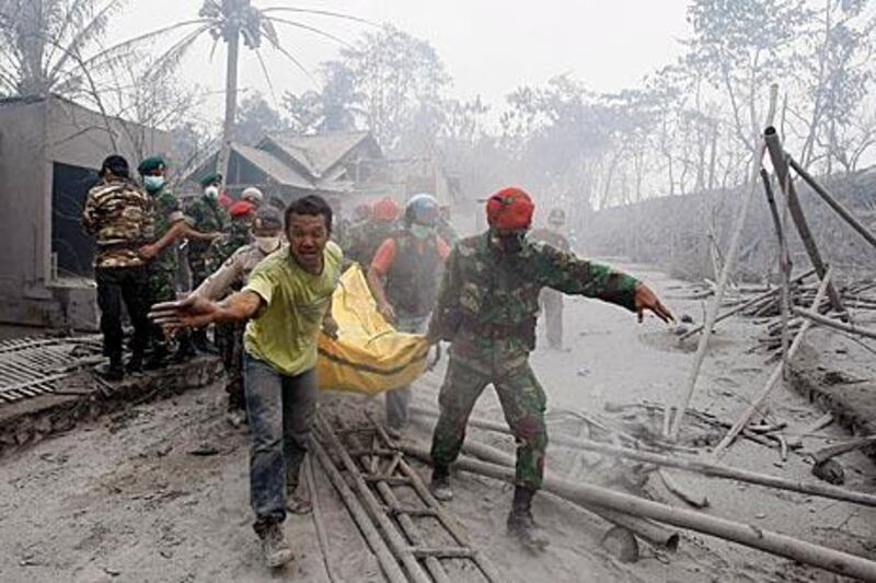 The volcano's eruption is the biggest in a century and blistering gas claims dozens of lives as rescue teams begin task of pulling dead from the ash. Click here for a picture gallery of the devastation.