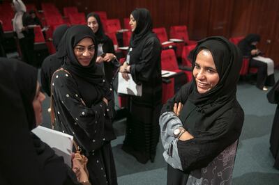 Abu Dhabi, UNITED ARAB EMIRATES, May 28, 2014:  
(R) Dr Shaika Al Ari, Federal National Council (FNC) Member, talks with former students as she attends a symposium focused on women's empowerment at the General Women's Union in Abu Dhabi on Wednesday, May 28, 2014.
(Silvia Razgova / The National)

