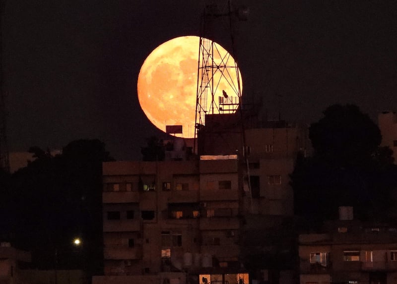 The final supermoon of the year in the Jordanian capital Amman. AFP
