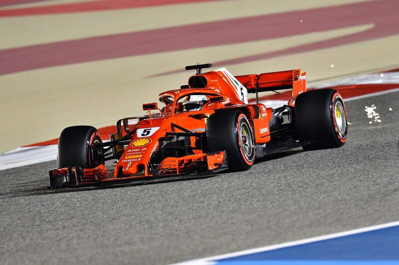 Ferrari's German driver Sebastian Vettel drives his car in the qualifying session to win pole position on April 7, 2018, ahead of the Bahrain Formula One Grand Prix at the Bahrain International Circuit in Sakhir.  / AFP PHOTO / GIUSEPPE CACACE