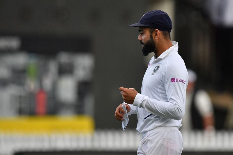 India's captain Virat Kohli walks from the field at the end of the day's play. AFP