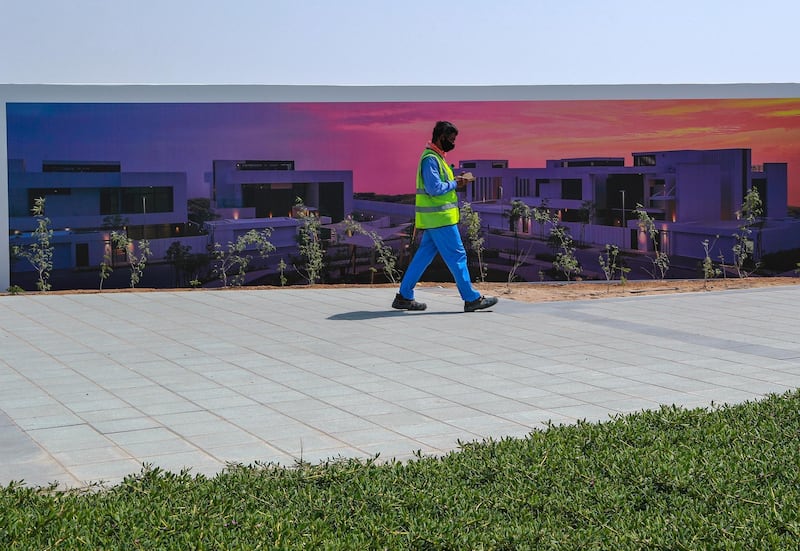 Abu Dhabi, United Arab Emirates, March 2, 2021.   Stock images of Yas residential areas.
A worker walks along a bike lane at Yas North.
Victor Besa / The National
Section:  NA