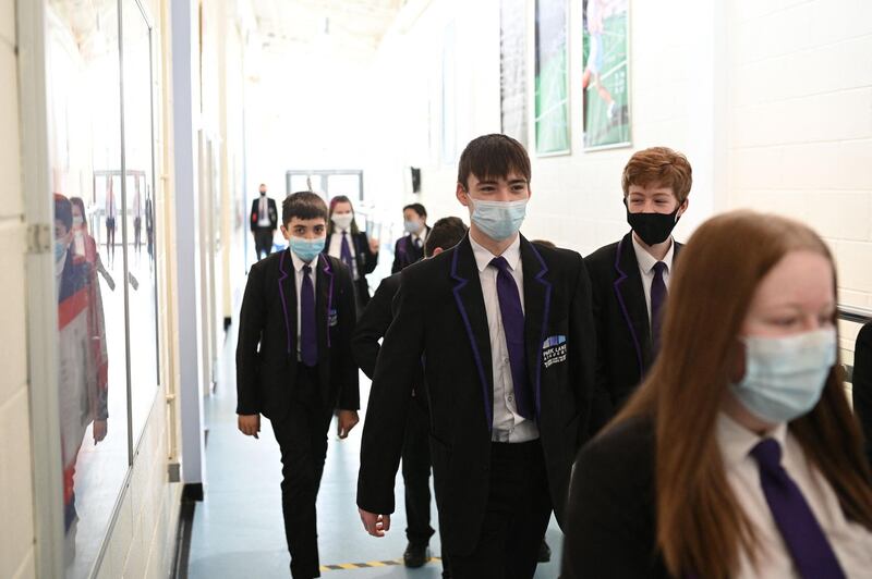 A Year 9 class walk along a corridoor at Park Lane Academy in Halifax. AFP