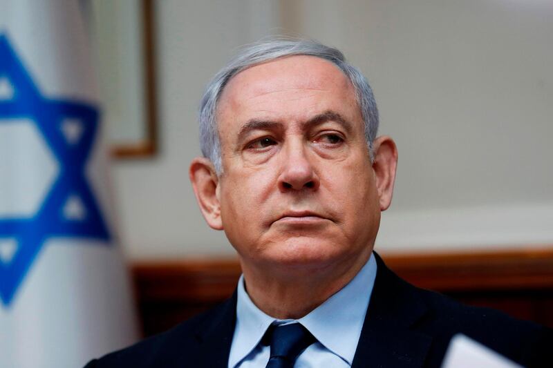 (FILES) In this file photo taken on February 9, 2020 Israeli Prime Minister Benjamin Netanyahu chairs the weekly cabinet meeting in Jerusalem. Israel president tasks Netanyahu with forming government. / AFP / POOL / RONEN ZVULUN
