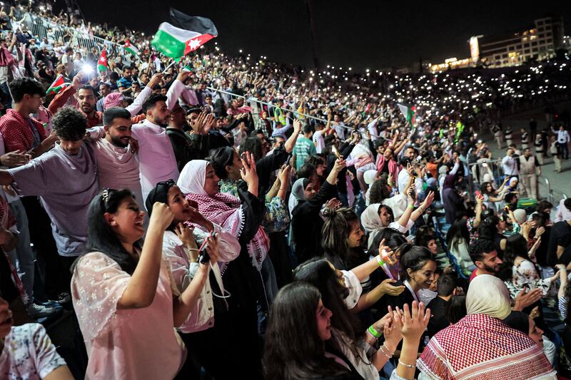 People attend a free concert ahead of the wedding of Jordan's Crown Prince at Amman International Stadium. AFP
