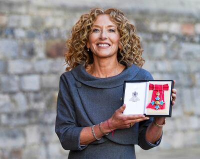 Kelly Hoppen poses following a ceremony at Windsor Castle in London, where she was made a Commander of the Order of the British Empire (CBE) in November 2021. AFP