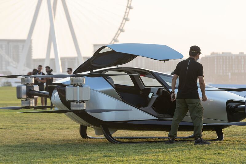 Guests check out the X2 flying car at Skydive Dubai on Monday evening. The vehicle has a top speed of 130kph. 
