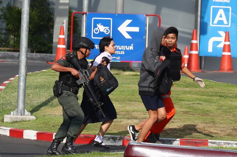 Thai security forces evacuate students stranded inside the Terminal 21 shopping mall following a gun battle to try to stop a soldier on a rampage after a mass shooting, Nakhon Ratchasima, Thailand. REUTERS