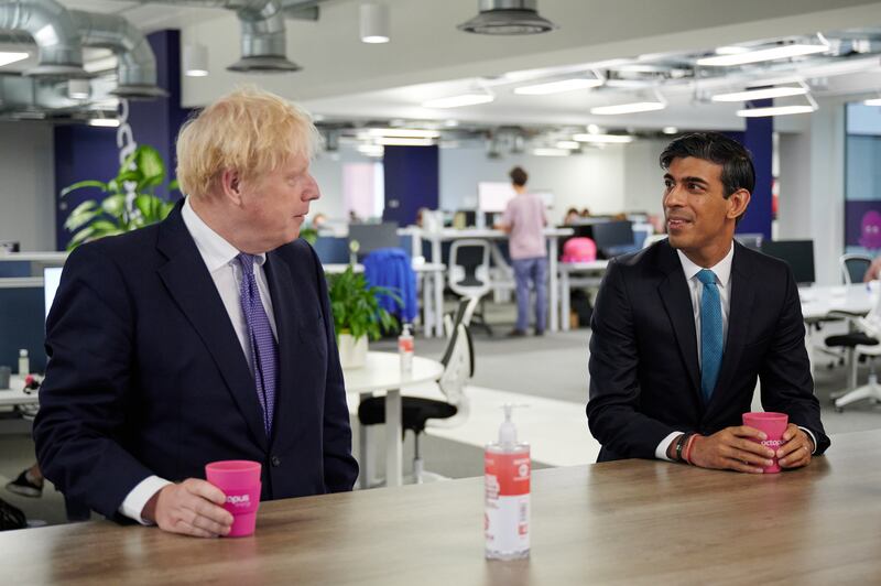 Mr Johnson and Mr Sunak visit the headquarters of Octopus Energy in London in October 2020. Getty Images