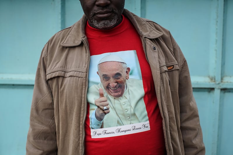 Father Paschal Mwijage of the St Joseph the Worker Parish in Nairobi's Kangemi slum wears a T-shirt featuring Pope Francis in Kenya in November 2015. Getty Images
