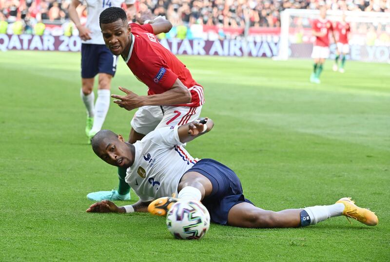 France's Presnel Kimpembe under pressure from Loic Nego of Hungary. Reuters