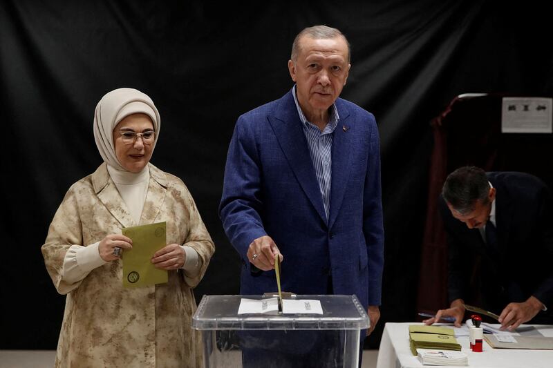 Turkey's President Recep Tayyip Erdogan and his wife Emine casts their ballots in Istanbul in the run-off election on Sunday. AFP