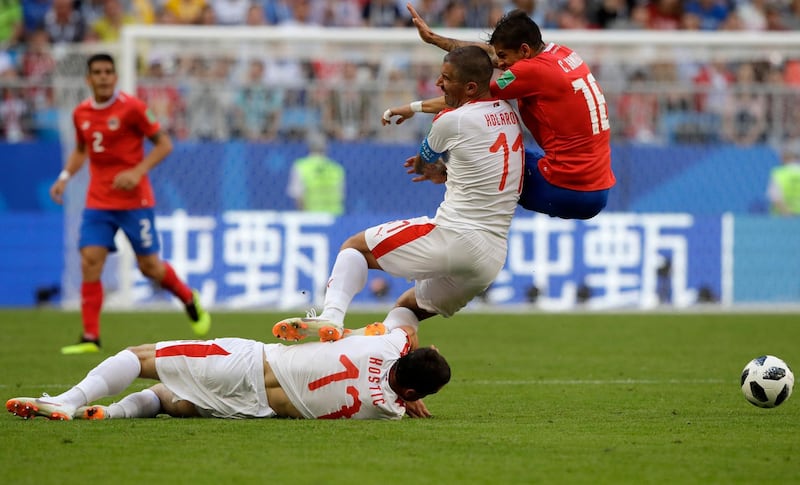 Costa Rica's Cristian Gamboa fights for the ball against Serbia's Aleksandar Kolarov during the group E match. Mark Baker / AP Photo