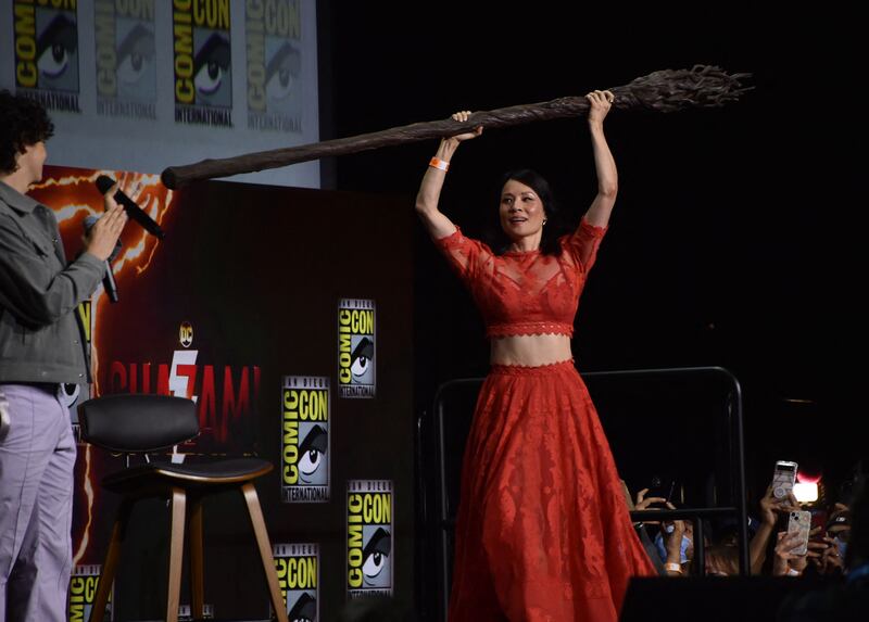 Actress Lucy Liu arrives on stage to speak about the film 'Shazam! Fury of the Gods' during the Warner Bros panel at Comic-Con. AFP
