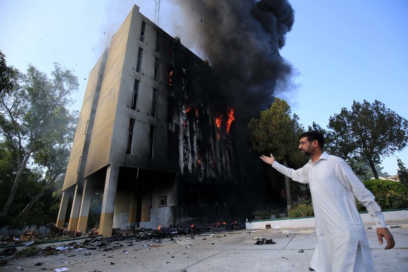 The Radio Pakistan building in Peshawar was set on fire during the protests. EPA