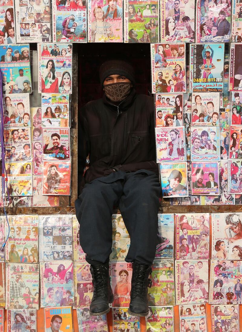 An Afghan CD salesman waits for customers at his stall in Kabul, Afghanistan. AP Photo