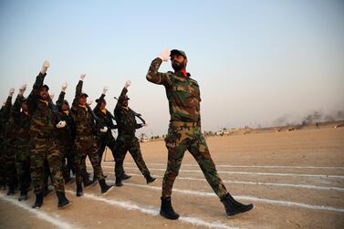 Members of the paramilitary Popular Mobilisation Forces (PMF) taking part in their graduation ceremony at a military camp in Karbala, Iraq, August 30, 2019. Reuters