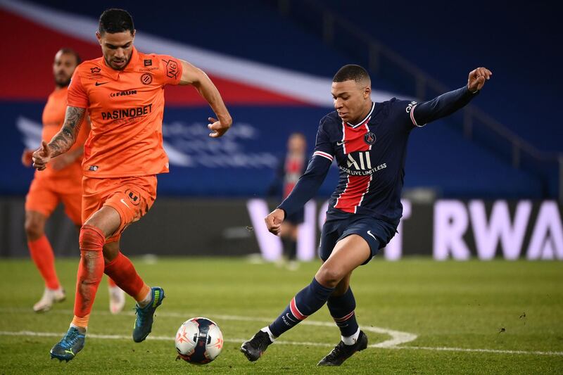 Montpellier's Portuguese defender Pedro Mendes vies for the ball with Paris Saint-Germain's French forward Kylian Mbappe. AFP