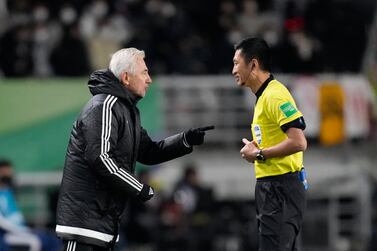 United Arab Emirates' head coach Lambertus Marwijk talks with referee Ma Ning of China during the final round of their Asian zone group A qualifying soccer match against South Korea for the FIFA World Cup Qatar 2022 at Goyang stadium in Goyang, South Korea, Thursday, Nov.  11, 2021.  (AP Photo / Lee Jin-man)