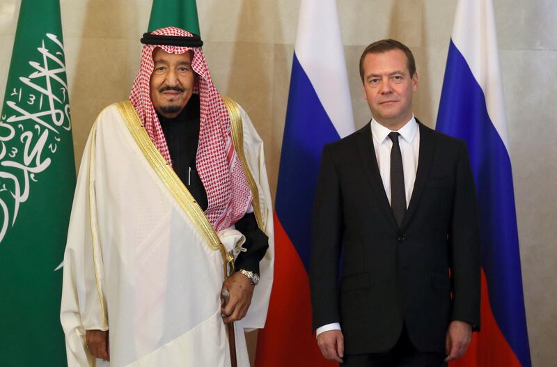 Russian Prime Minister Dmitry Medvedev, right, and Saudi Arabia's King Salman pose for a photo during a meeting in Moscow, Russia, Friday, Oct. 6, 2017. (Alexander Astafyev, Sputnik, Government Pool Photo via AP)