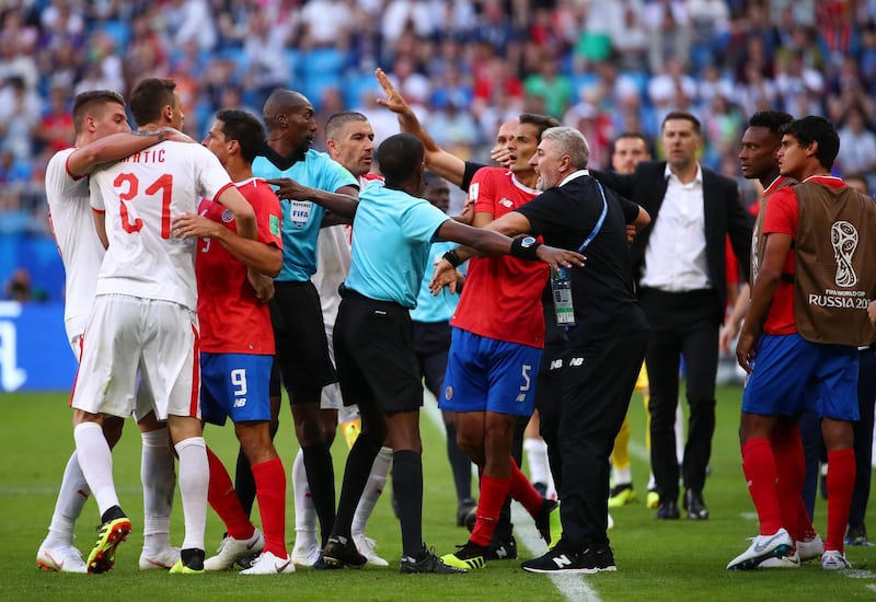 Serbia's Nemanja Matic is separated after clashing with Costa Rica assistant manager Luis Marin. Michael Dalder / Reuters