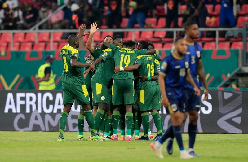 Senegal's Sadio Mane celebrates scoring the first goal with teammates on Tuesday. Reuters