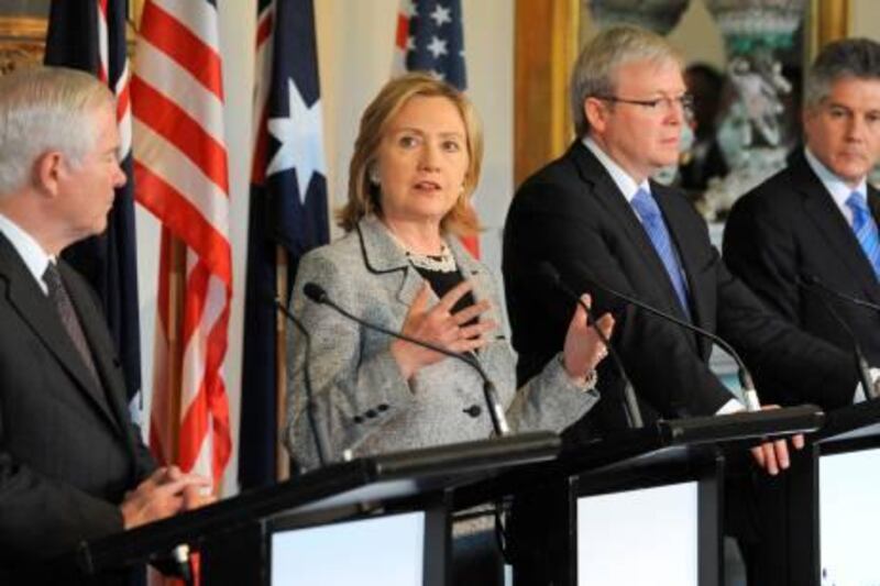US Secretary of State Hillary Clinton (2L) speaks at a joint press conference withd US Secretary of Defense Robert Gates (L) and their Australian counterparts, Foreign Minister Kevin Rudd (2R) and Defence Minister Stephen Smith (R) after the annual AUSMIN defence and security talks in Melbourne on November 8, 2010. The United States urged China to be a "responsible player" as its global influence grows and stressed its commitment to Asia after security talks with Australia during a regional diplomatic push. Secretary of State Hillary Clinton made the comment after meeting Australian officials alongside US Defence Secretary Robert Gates, in talks which produced an agreement to cooperate on security surveillance in outer space. AFP PHOTO/William WEST
 *** Local Caption ***  603920-01-08.jpg