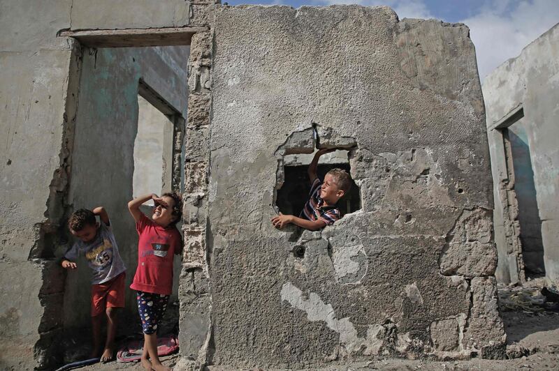 Children play in a deserted house at the Shati Palestinian refugee camp in Gaza City.  AFP