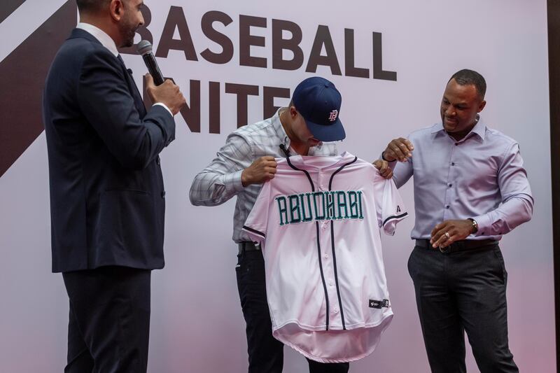 New York Yankees World Series champion Nick Swisher, centre, with former MLB star Adrian Beltre, right, and Baseball United’s chief executive Kash Shaikh, left. 