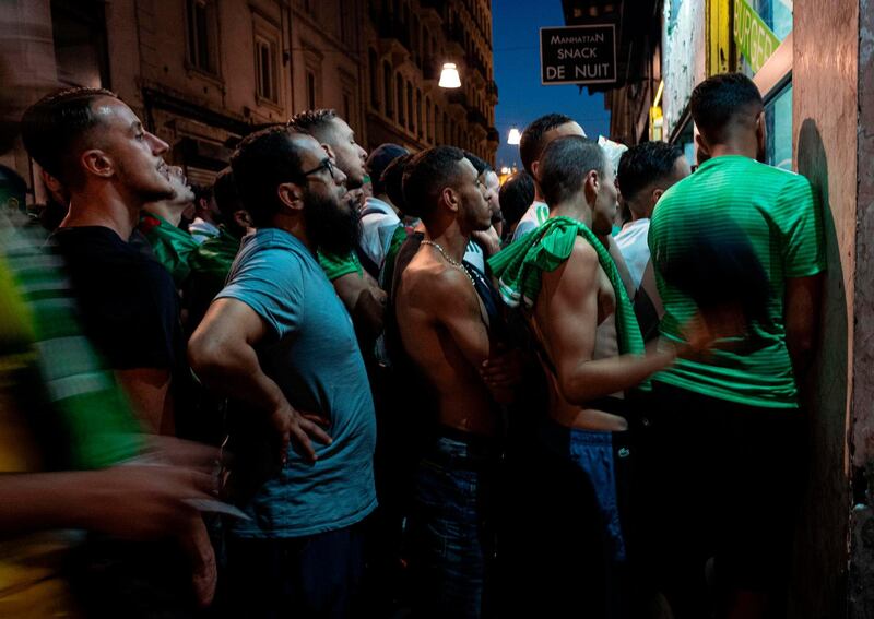 Algeria supporters watch the 2019 Africa Cup of Nations semi-final against Nigeria in Guillotiere district in Lyon, central eastern France. AFP