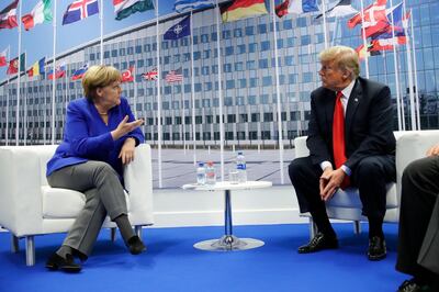President Donald Trump meets with German Chancellor Angela Merkel during their bilateral meeting at the NATO Summit in Brussels, Belgium, Wednesday, July, 11, 2018. (AP Photo/Pablo Martinez Monsivais)