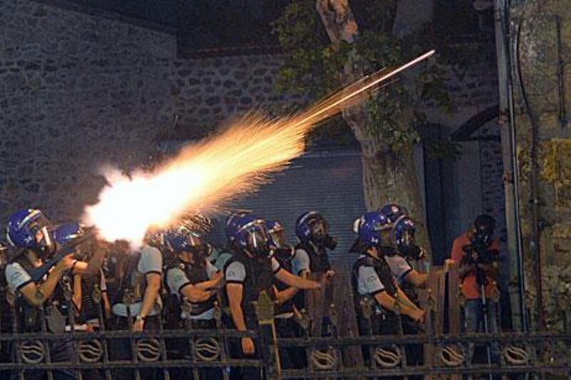 Riot police fire tear gas at protesters near the former Ottoman palace, Dolmabahce, where Turkey's Prime Minister Recep Tayyip Erdogan maintains an office in Istanbul. AP Photo