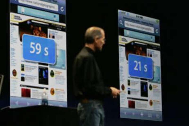 The Apple CEO Steve Jobs looks at a screen showing the new iPhone 3G during his keynote speech at the Apple Worldwide Developers Conference in San Francisco.