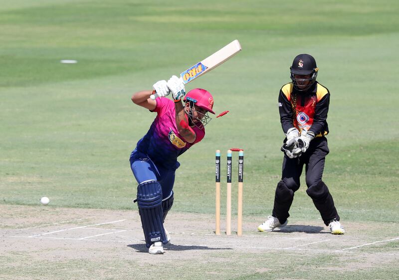 UAE's Aryan Lakra is bowled by PNG's Riley Hekure