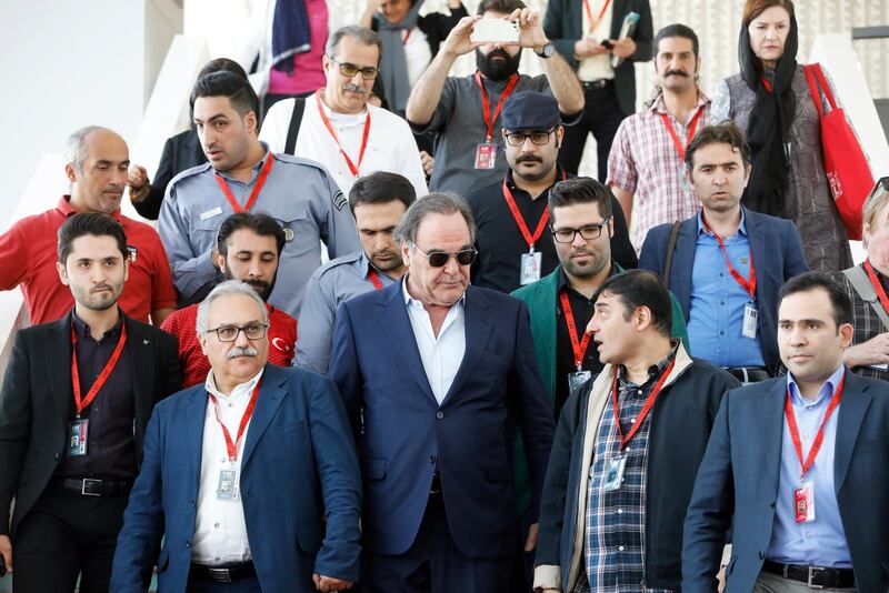 epa06691210 US director Oliver Stone (C) leaves after a press conference at the 36th International Fajr Film Festival in Tehran, Iran, 25 April 2018. Media reported that Stone criticised US president Donald J. Trump and his allies diplomacy against Iran. Stone is in Tehran to attend the film festival which runs from 19 to 27 April 2018.  EPA/ABEDIN TAHERKENAREH