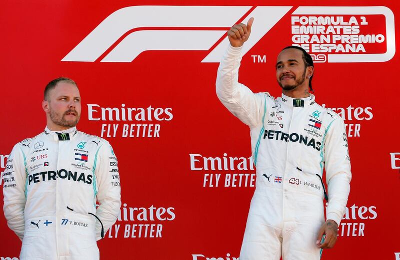 Formula One F1 - Spanish Grand Prix - Circuit de Barcelona-Catalunya, Barcelona, Spain - May 12, 2019 First placed Mercedes' Lewis Hamilton and second placed Mercedes' Valtteri Bottas on the podium. REUTERS/Jon Nazca