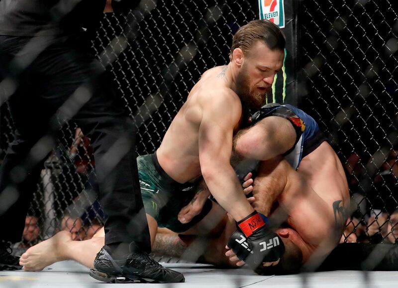 LAS VEGAS, NEVADA - JANUARY 18: Conor McGregor throws a right against Donald Cerrone in the first round in their welterweight bout during UFC246 at T-Mobile Arena on January 18, 2020 in Las Vegas, Nevada.   Steve Marcus/Getty Images/AFP