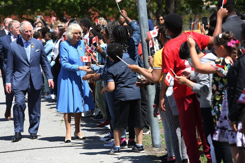 The Royal couple greet students during a visit at Assumption Catholic school on May 18, 2022 in Ottawa. AFP
