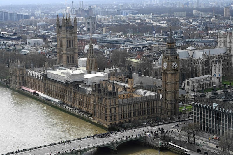 (FILES) This file photo taken on March 29, 2017 shows the Palace of Westminster, comprising the House of Commons and the House of Lords, which together make up the Houses of Parliament, are pictured on the banks of the River Thames alongside Westminster Bridge in central London on March 29, 2017. 
Bed bugs, leaky sewers, fire hazards: Britain's iconic parliament building is in urgent need of drastic repair after years of delays by lawmakers worried about costs and having to move out. At a parliamentary debate on on January 31, 2018, MPs will debate and vote on different options, including the possibility of a full relocation to carry out an overhaul of the famous Palace of Westminster, which includes the Houses of Parliament and the clock tower housing Big Ben.
 / AFP PHOTO / Justin TALLIS
