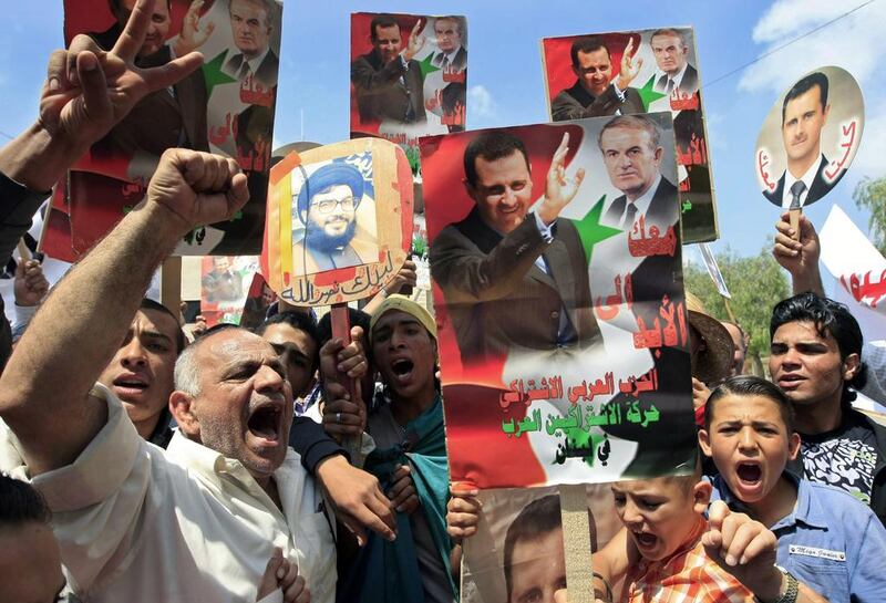 Lebanese pro-Syrian government protesters chant slogans to show their solidarity during a demonstration in the southern port city of Sidon, Lebanon.  Mohammed Zaatari / AP Photo