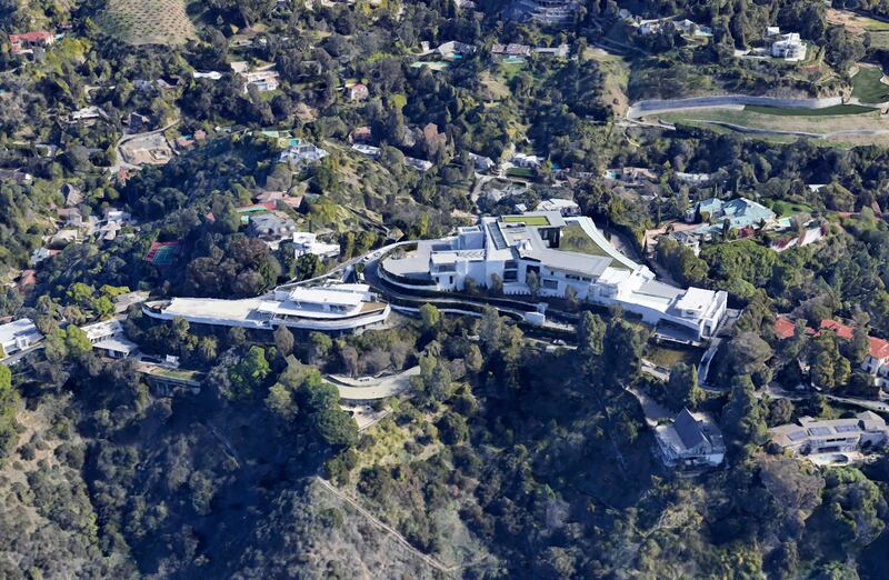 The mansion has nine bedrooms, a private nightclub, four-lane bowling alley, beauty salon, spa, five swimming pools, a 50-seat movie theatre and an underground garage for 50 cars. Photo: Google Earth