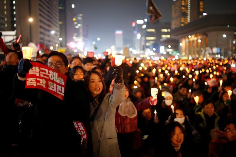 People attend a protest demanding South Korean president Park Geun-hye’s resignation in Seoul on December 31, 2016. Kim Hong-ji / Reuters