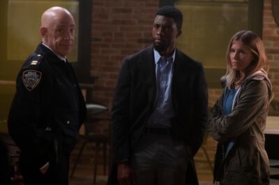 This image released by STXfilms shows, from left, J.K. Simmons, Chadwick Boseman and Sienna Miller in a scene from "21 Bridges," in theaters on Nov. 22. (Matt Kennedy/STXfilms via AP)