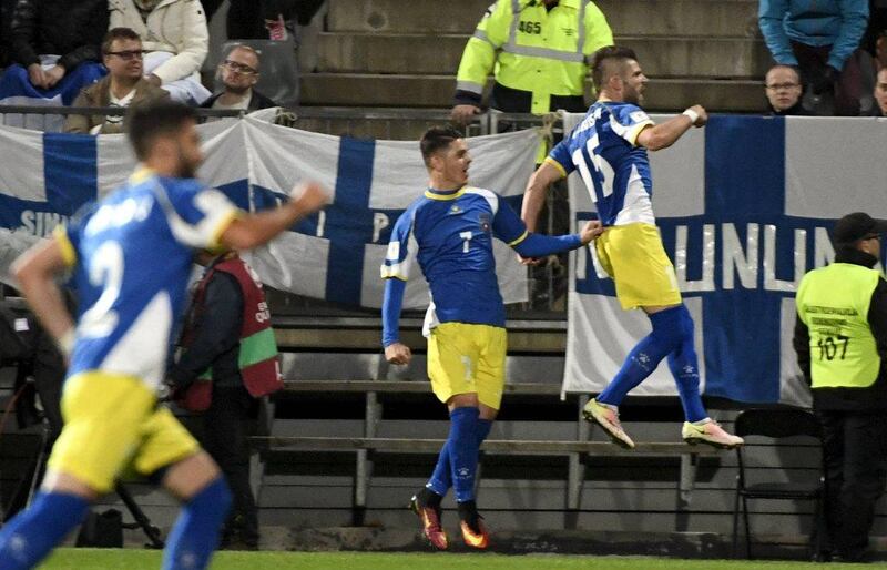Valon Berisha, right, celebrates after scoring Kosovo's first ever goal in a 1-1 draw against Finland. Jussi Nukari / Lehtikuva