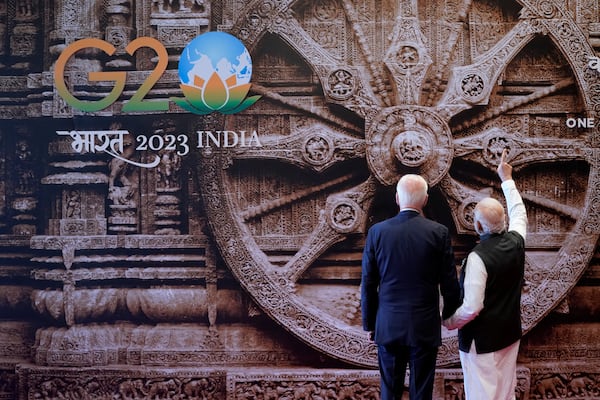 Indian Prime Minister Narendra Modi shows a mural of the Konark Sun temple wheel from the Indian state of Orissa to President Joe Biden in 2023. Reuters