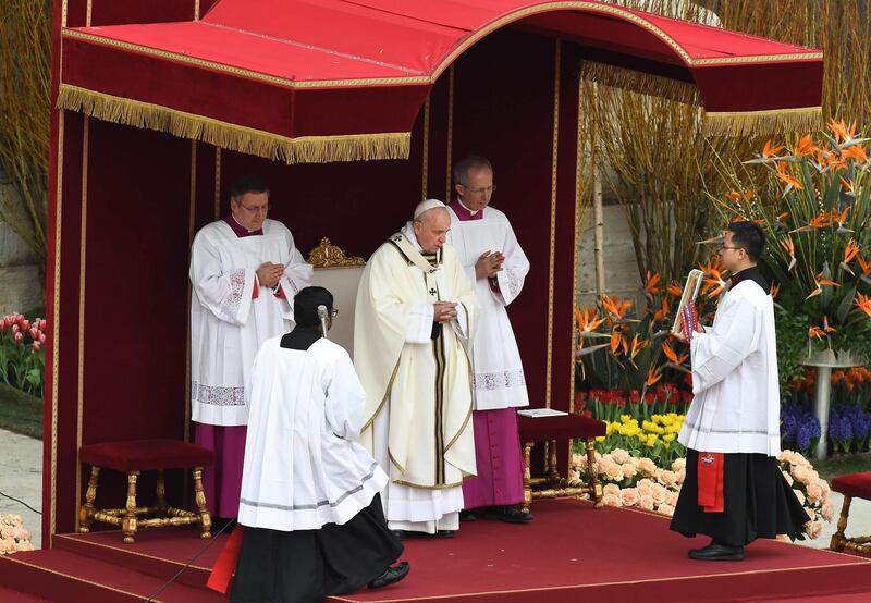Pope Francis celebrates the Easter Sunday mass outside St Peter's Basilica on St Peter's Square in the Vatican City. AFP