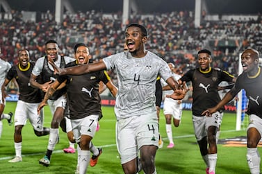 South Africa's midfielder #4 Teboho Mokoena (C) celebrates with teammates after scoring a goal during the Africa Cup of Nations (CAN) 2024 round of 16 football match between Morocco and South Africa at the Stade Laurent Pokou in San Pedro on January 30, 2024.  (Photo by SIA KAMBOU  /  AFP)