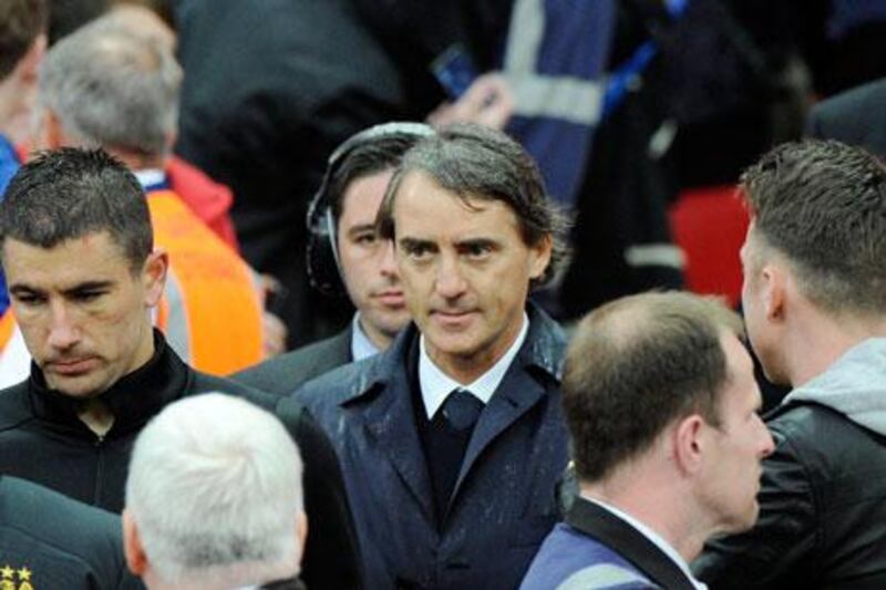 Roberto Mancini was brought in by Manchester City in December 2009. Andy Rain / EPA